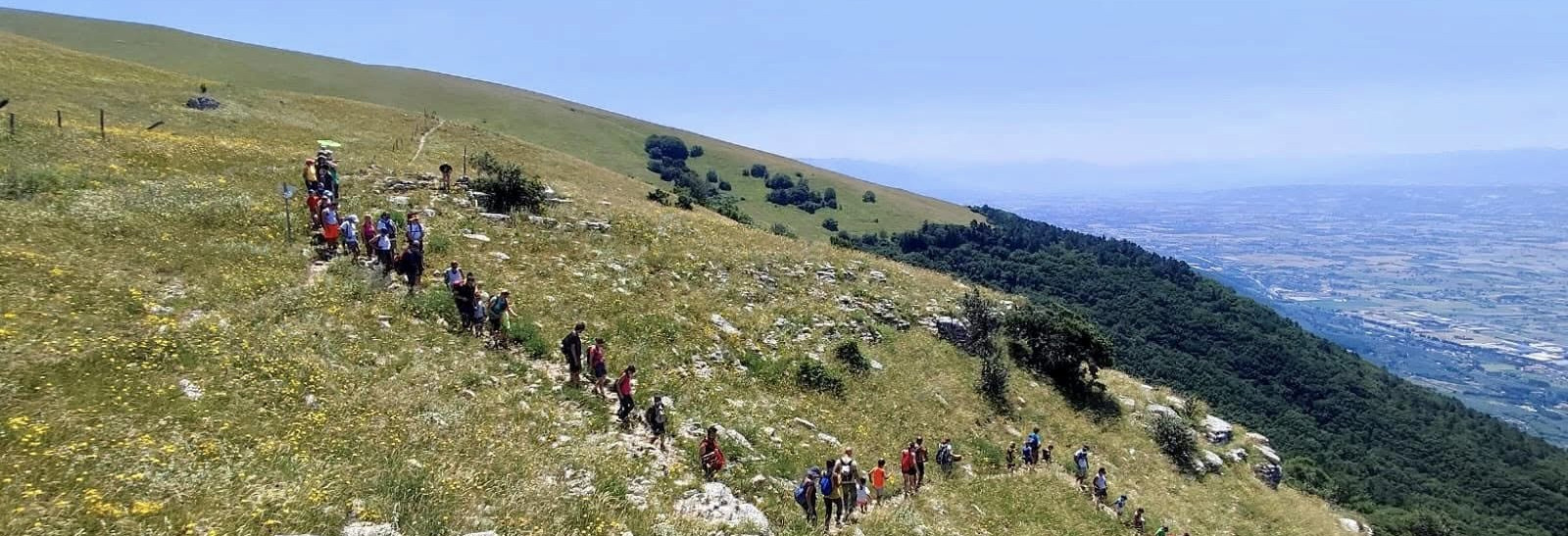 people trekking on Mount Subasio