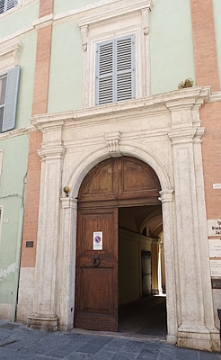 Monumental entrance of Palazzo Conestabile Della Staffa, residence of Guido Pompilij and the poet Vittoria Aganoor.