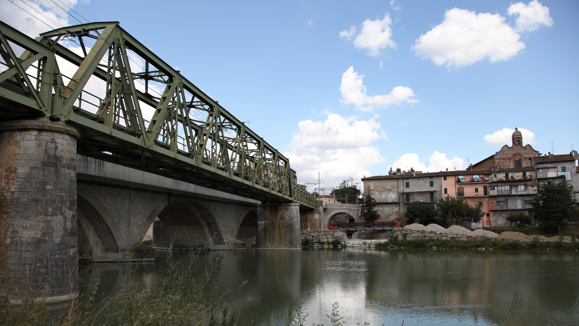 Bridge over the Tiber River with the historic centre of Umbertide in the background.