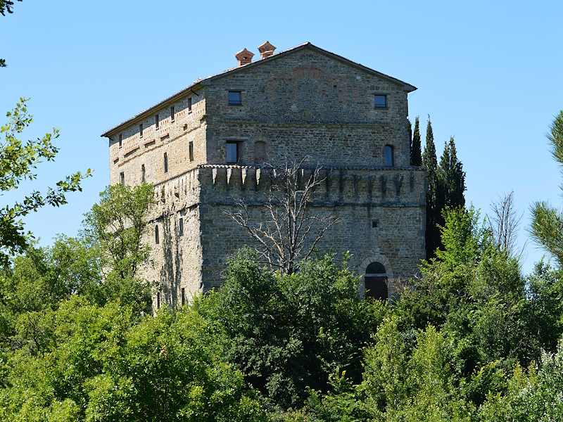 Rocca d'Aries in Montone, an ancient medieval fortress surrounded by the greenery of the Umbrian hills.