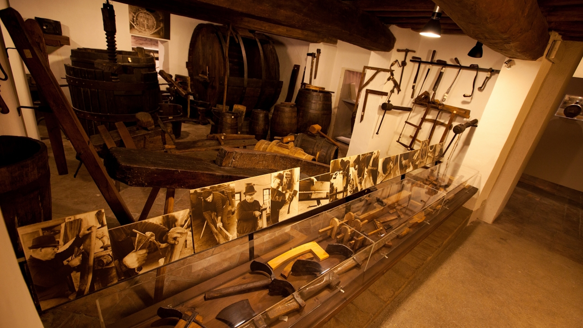 Ancient tools, presses and barrels displayed at the Torgiano Wine Museum, dedicated to the history of winemaking.