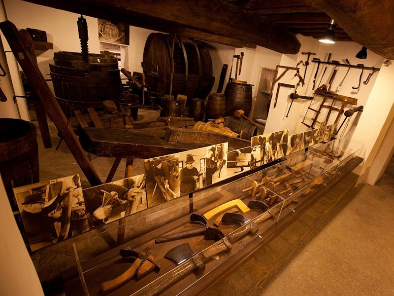 Ancient tools, presses and barrels displayed at the Torgiano Wine Museum, dedicated to the history of winemaking.